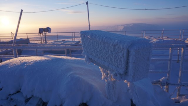 snowcoveredinstrumentsonrooftop.jpg