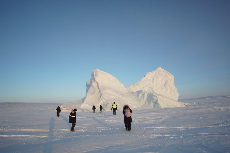 Visiting an iceberg on the fjord 