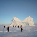 Visiting an iceberg on the fjord 